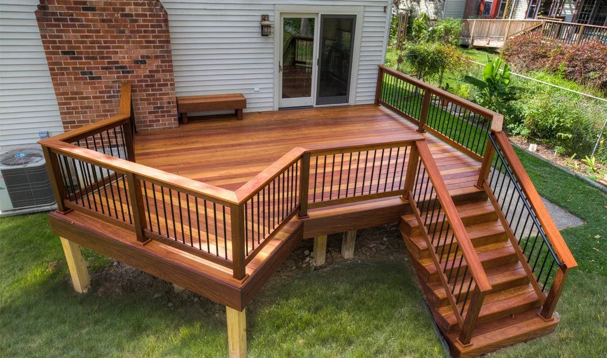 Finished hardwood deck with black balusters built by Lamar Homes